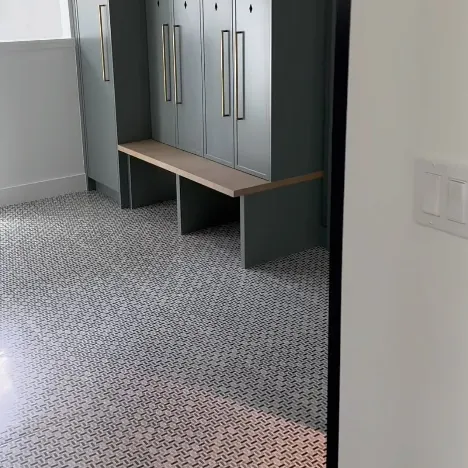 Black lockers with a wood bench